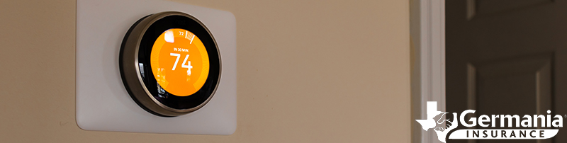 A Nest smart thermostat displaying 74 degrees