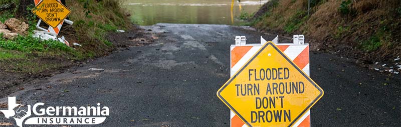 A sign warning against a flooded road in Texas