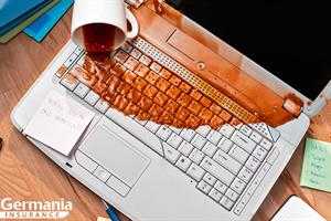 A ruined computer covered in spilled coffee emphasising the need for cloud storage.
