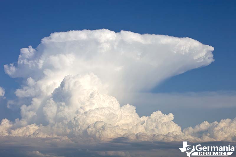 A single cell thunderstorm with anvil cloud