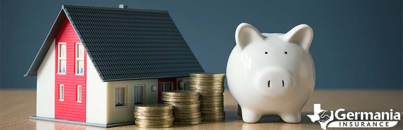 A piggy bank next to a home depicting increased home insurance costs