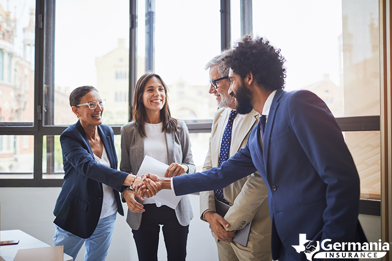 A man shaking hands as he begins his new career in the insurance industry.