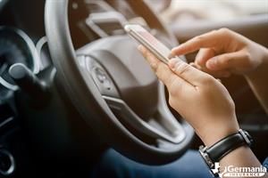 A person using an safe driving app to prevent distracted driving