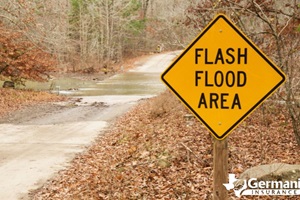 A sign near water crossing warning of flash floods