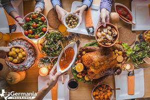 A Thanksgiving table with turkey and other Thanksgiving menu items
