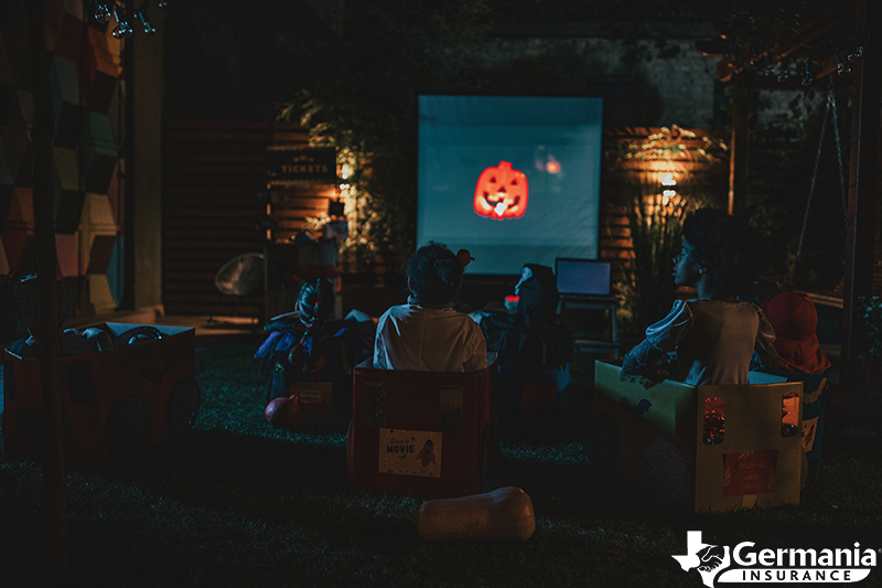 Kids watching a Halloween movie as an alternative to trick-or-treating