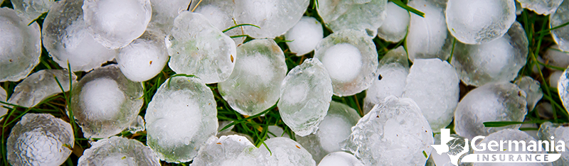 What is hail? Hailstones covering grass