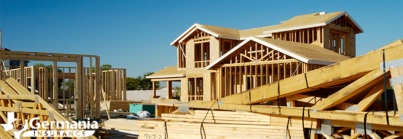 A home being rebuilt with building materials in foreground